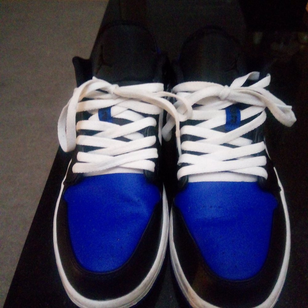 Low  top Jordans size 12 blue, black and white.